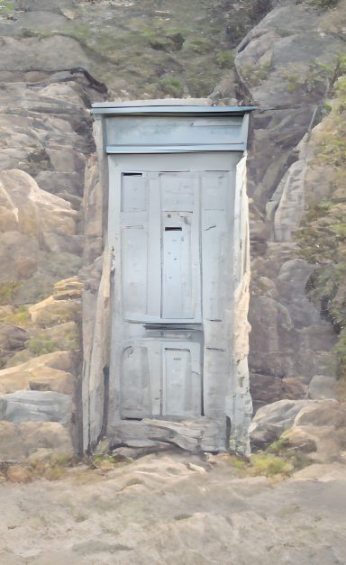 A light blue door built into a rockface.